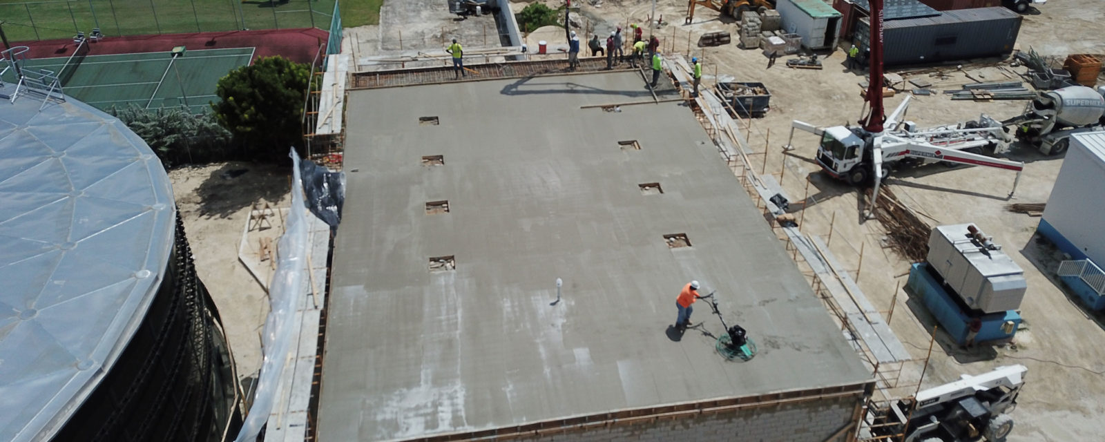 Worker on top of building in construction site